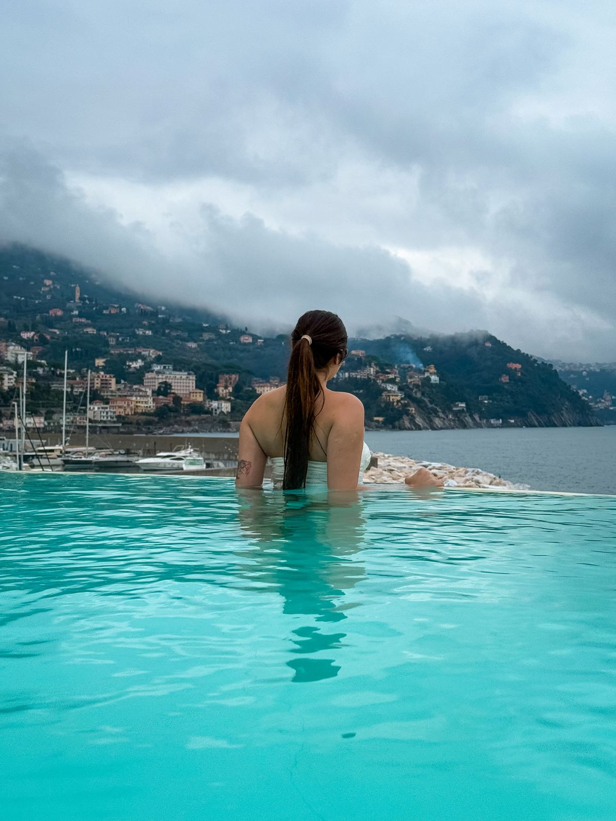 Infinity pool overlooking a coastal town