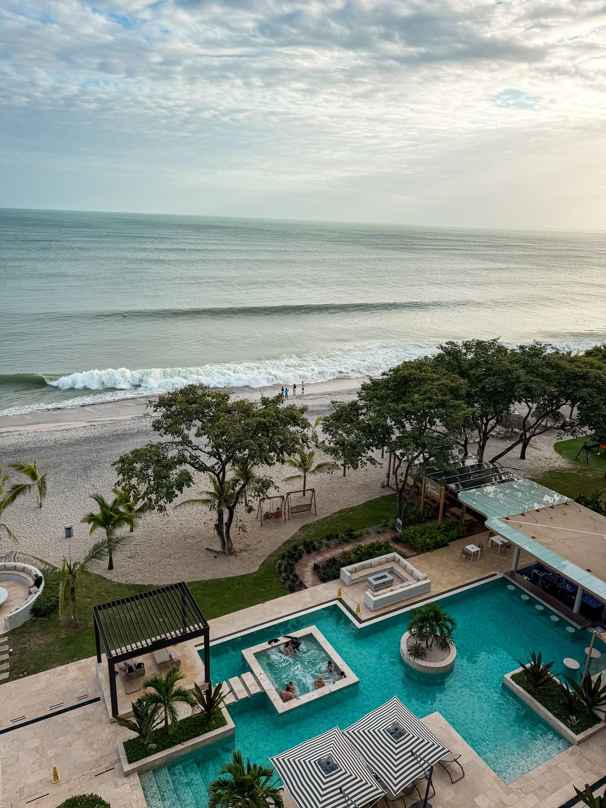Oceanfront resort pool at dusk