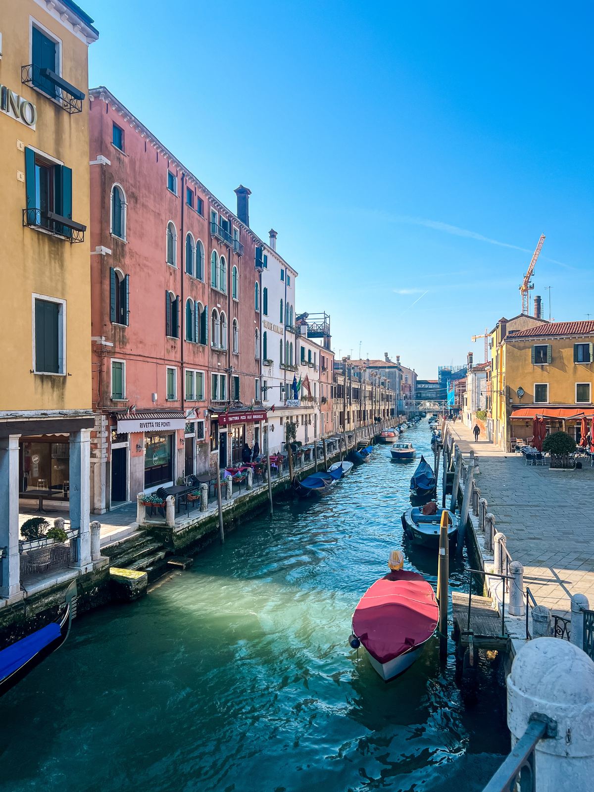 Canal-side buildings and boats in warm afternoon light